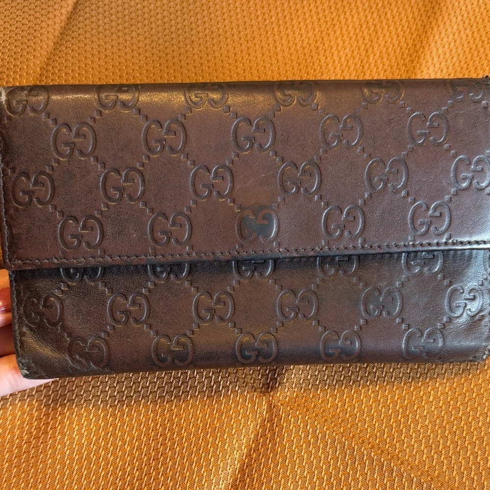 Gucci Dark Brown Logo Embossed Leather Clutch